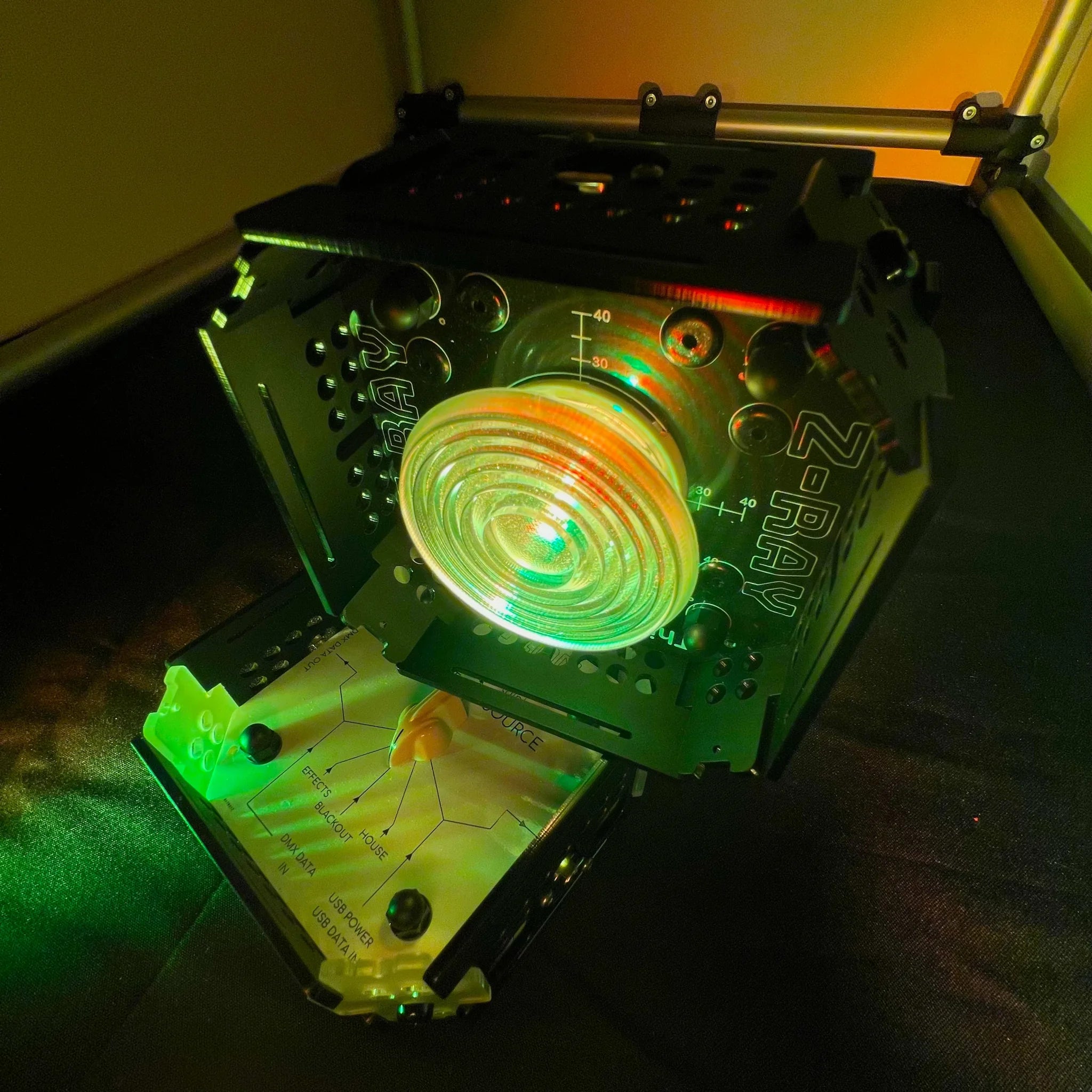 Starter Kit consisting of 1 STATION-X and 1 Z-RAY with Fresnel lens, set to low-level illumination in yellowy-orange.